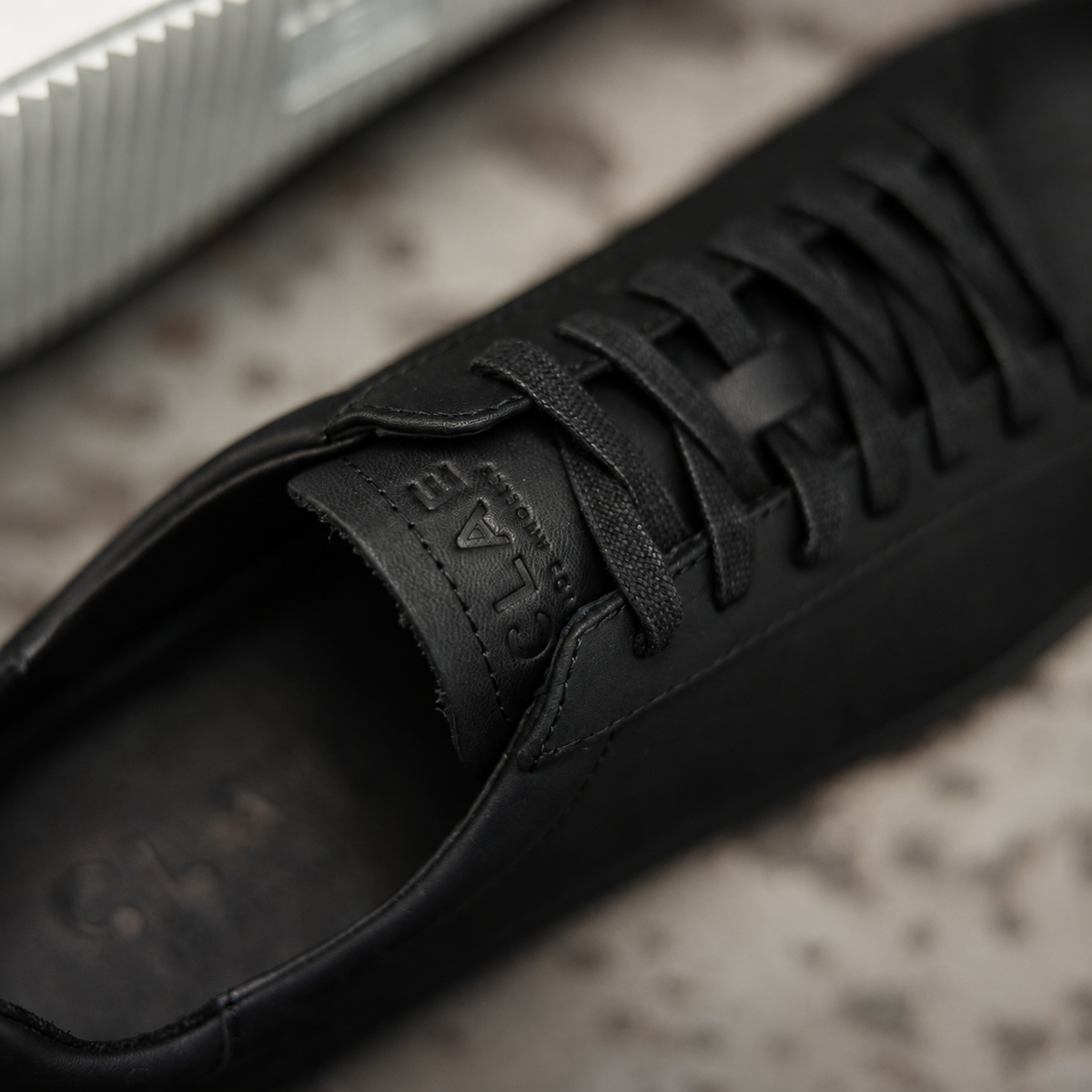 CLAE Bradley Essentials Triple Black Leather — tongue and laces detail