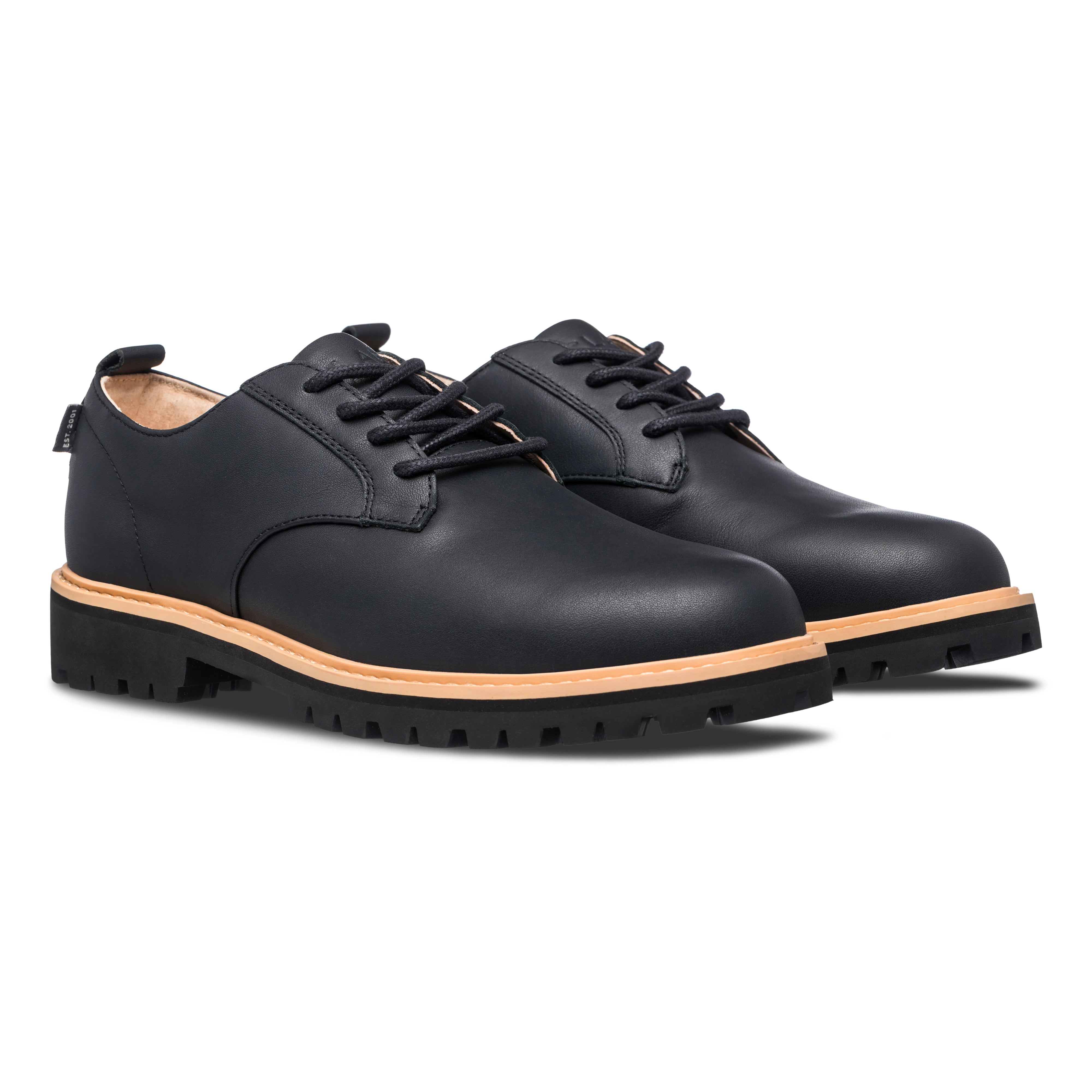 Three-quarter view of Logan Heritage Collection derby shoe in Black, highlighting premium leather upper and lug sole with welt construction.