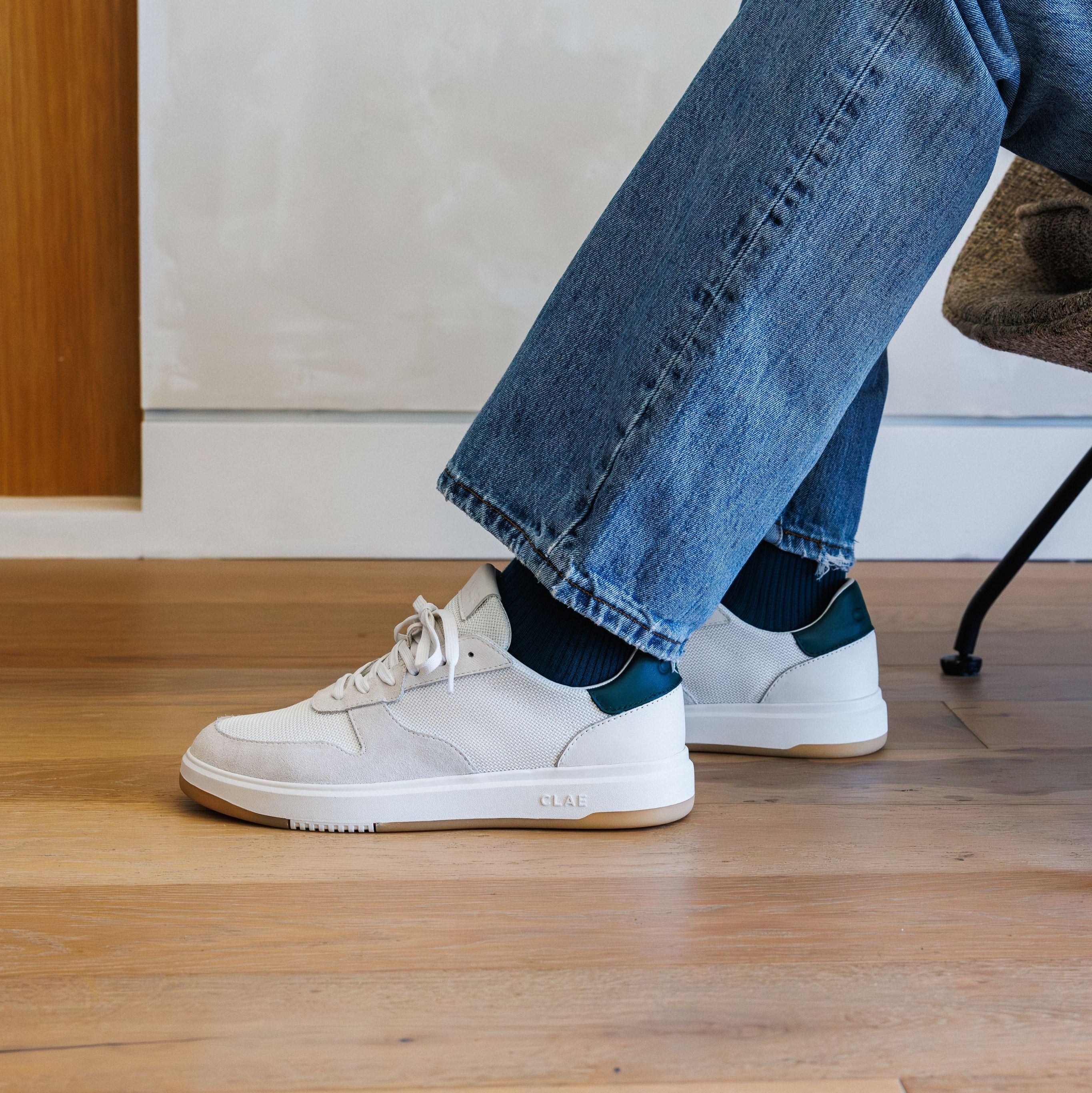 Moses sneaker in White Pine Needle worn in casual lifestyle setting, highlighting comfort, durability, and timeless style.