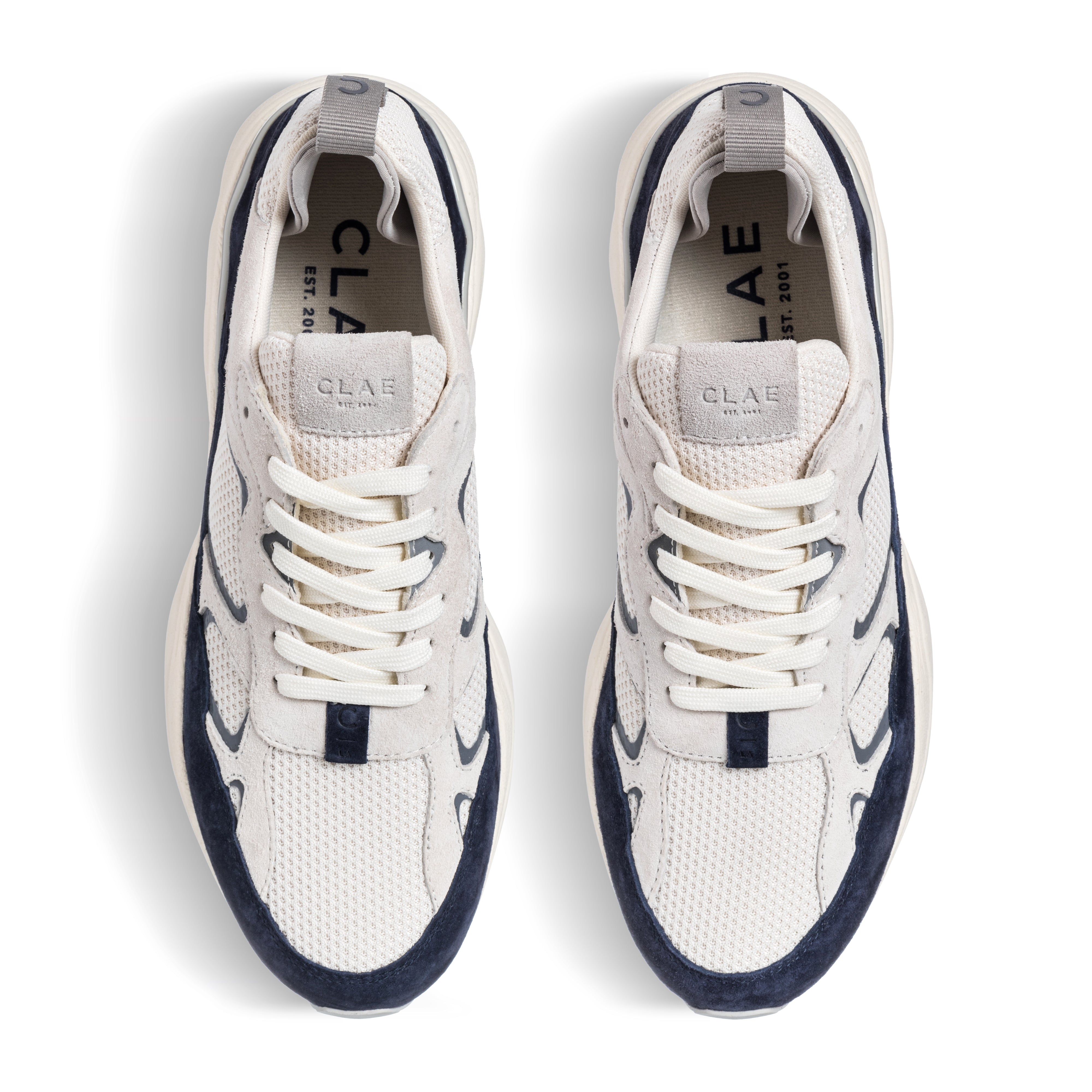 Top view of Salazar runner in Off-White Navy, showing suede and recycled mesh upper with precise lace details.
