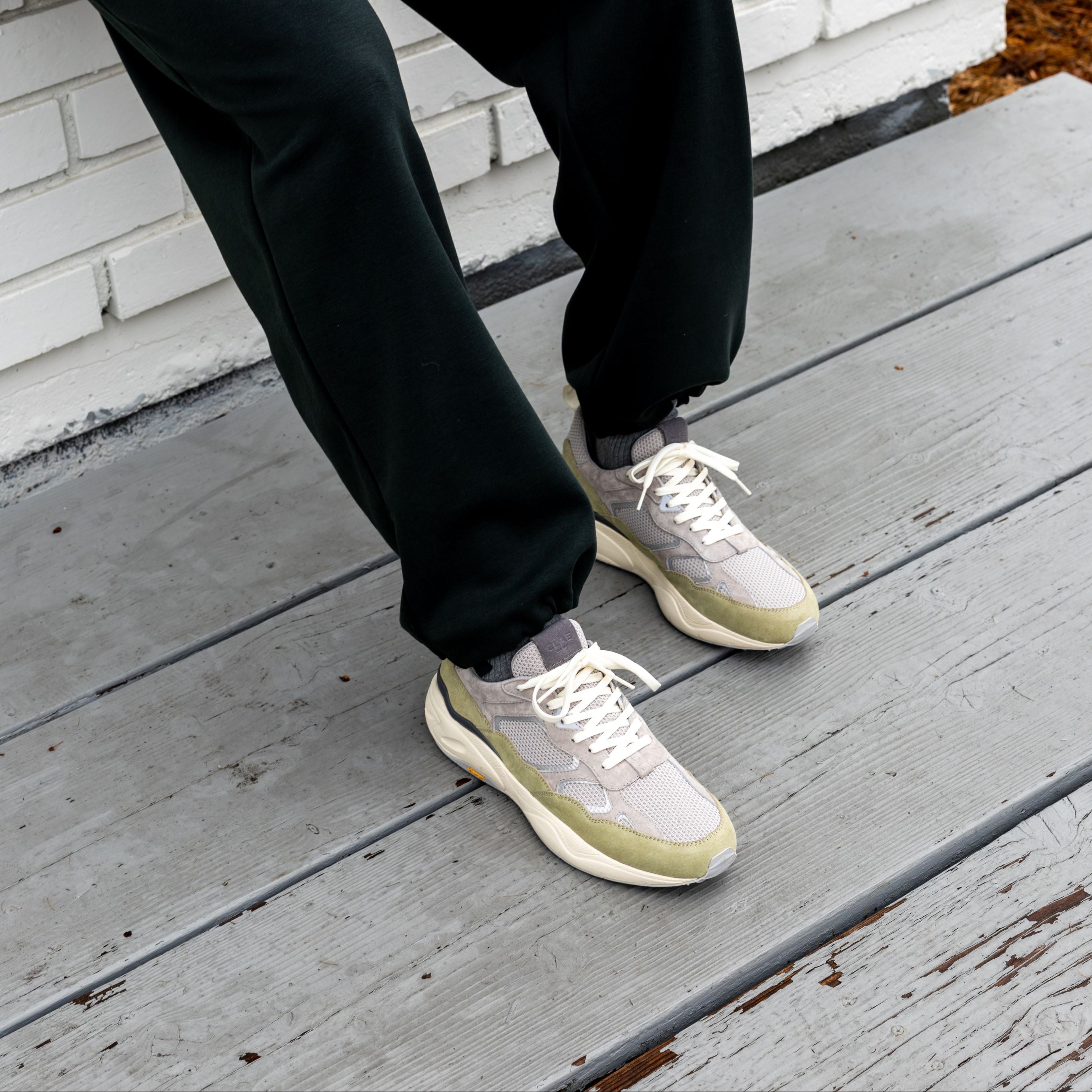 Salazar runner in Quiet Gray Tea worn in casual lifestyle setting, highlighting lightweight, flexible construction and VIBRAM outsole.