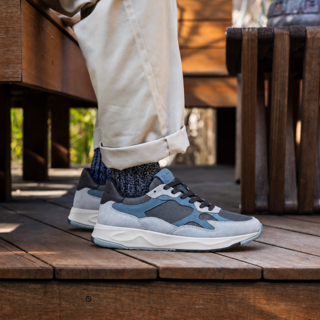 CLAE ZUMA Quarry Blue Mirage Navy AW26 worn with cream trousers