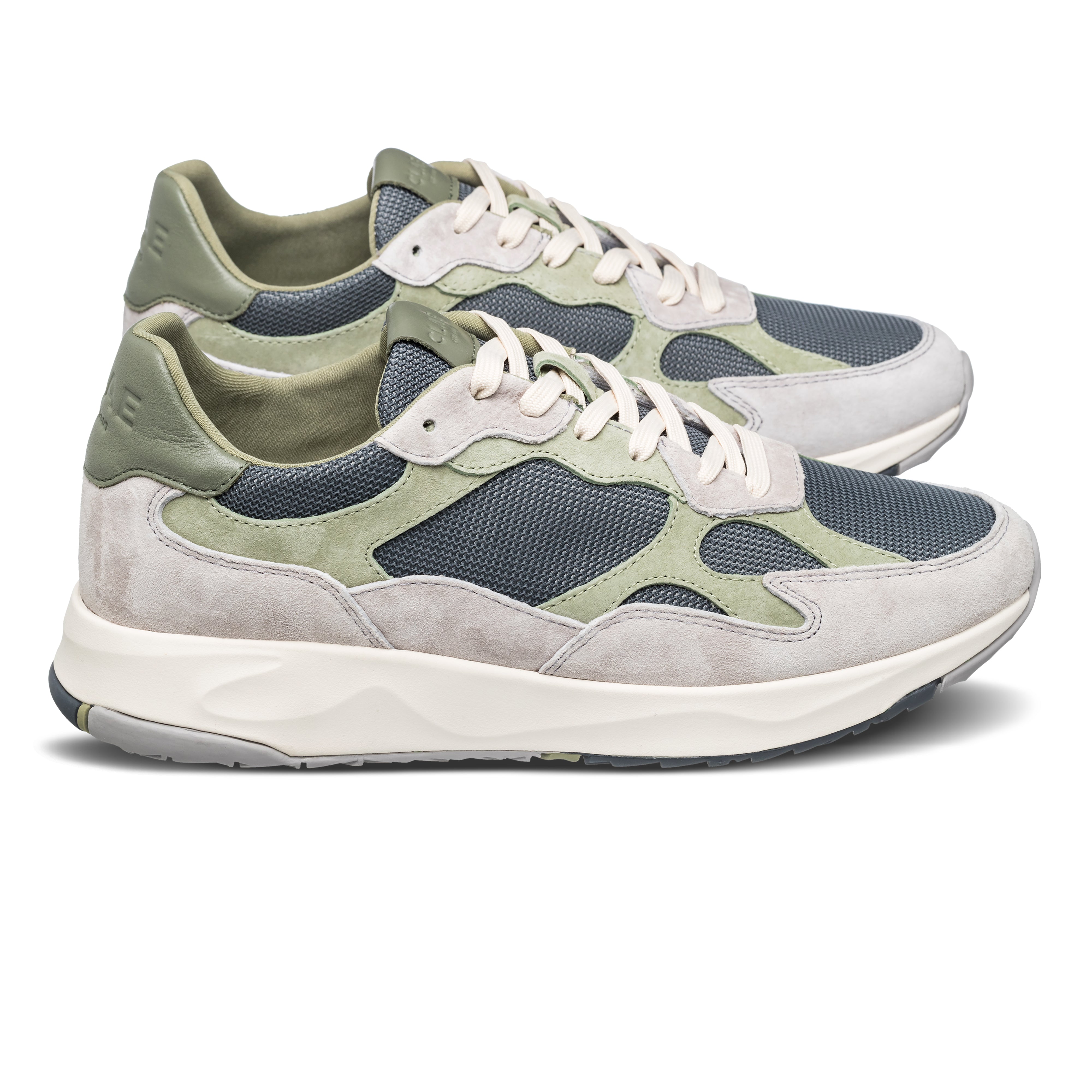 Zuma runner in Quiet Gray Tea with leather, suede, and recycled mesh upper, side view showing premium runner silhouette and Desert Track outsole.