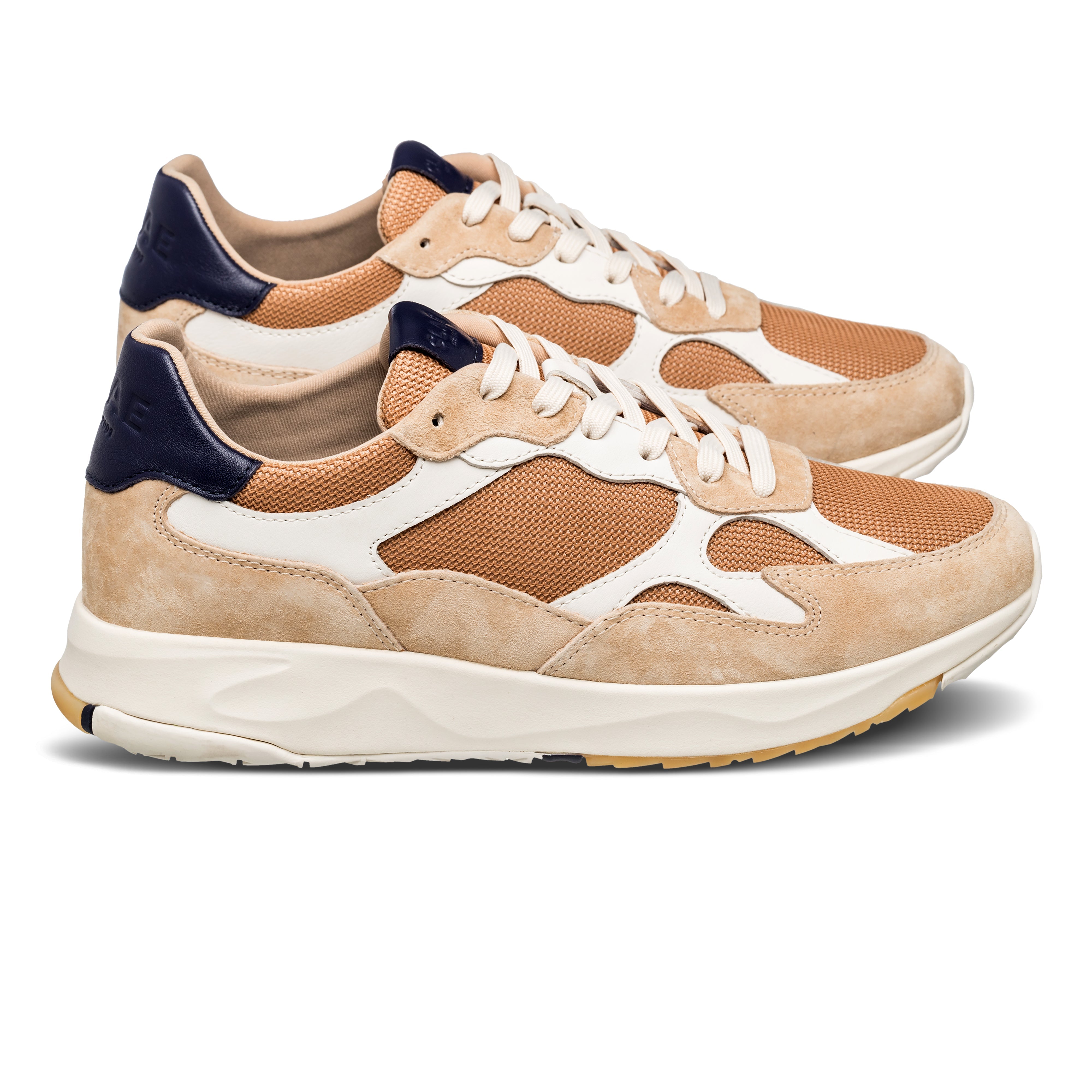 Zuma runner in Safari Doe Navy with leather, suede, and recycled mesh upper, side view showing premium runner silhouette and Desert Track outsole.